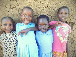 A hopeful future: Mackline (second from right) stands against a wall at school with three of her friends.