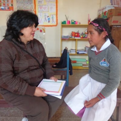 Neyaz speaks with young girl