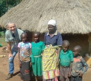 Peter standing with Mary and her grandchildren