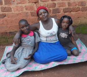 Rebecca and her daughters smiling for the camera