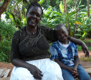a girl sits with her grandmother, lovingly cuddling one another