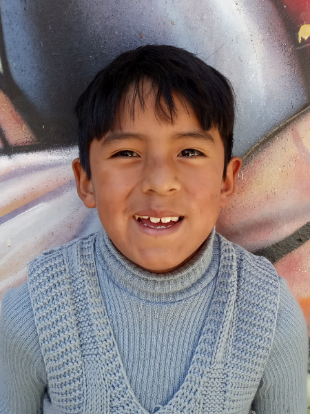 young boy smiling for camera