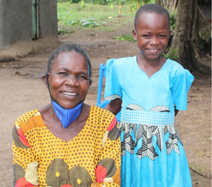 a young girl and her grandma smiling for the camera