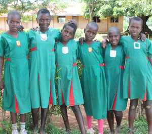 a group of girls stand hugging each other
