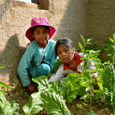 Silvia with her sister in the garden.