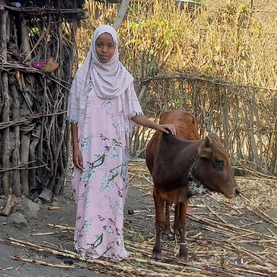 Medina with her calf in an outdoor setting