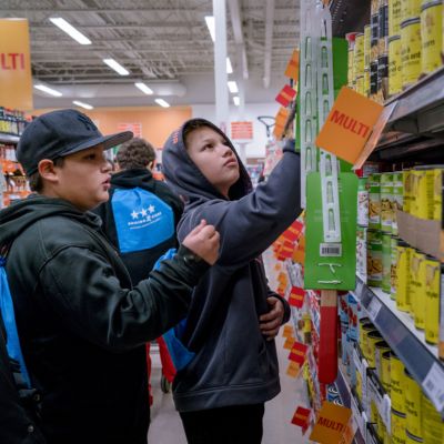 Children shop for groceries in Natoaganeg (Eel Ground First Nation), NB.