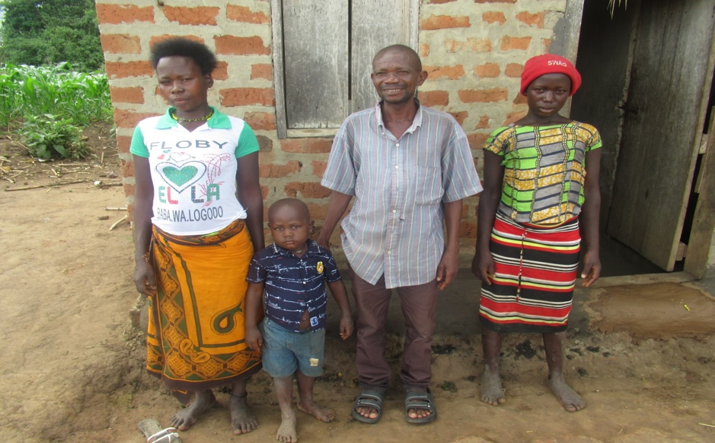 Otoma and his family pose for a photo