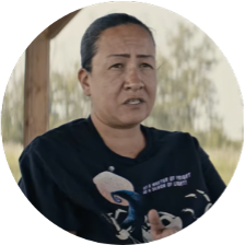 Rosa making paster in a community kitchen