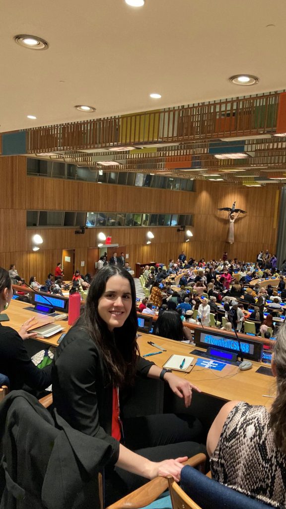 woman sitting in UN at event