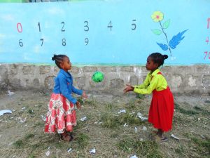 two girls playing on the playground