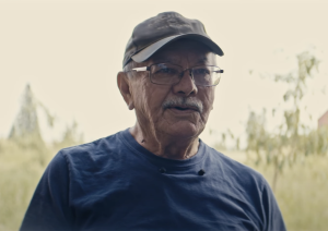 headshot of a man in a baseball cap