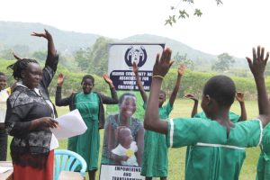 children standing with arms in the arm