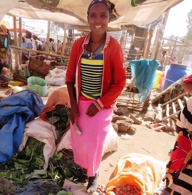 Buzeye selling her vegetables at the market