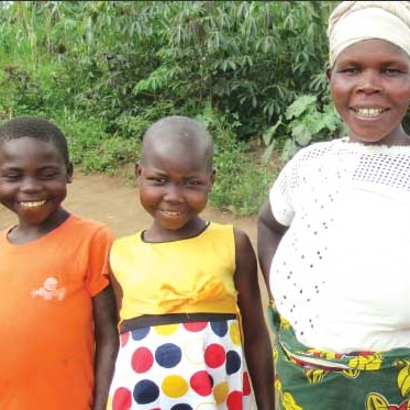 Berochan standing with her children